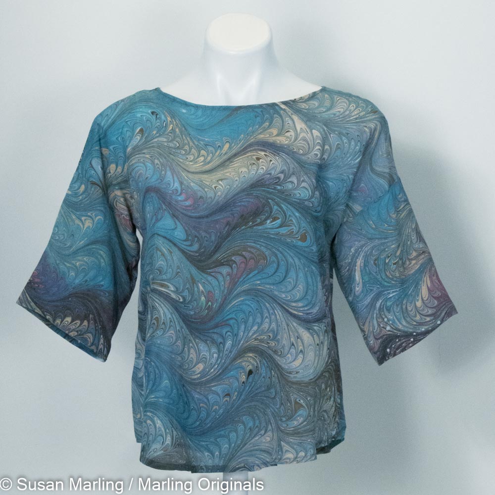 marbled silk blouse in teal, tan and mauve with round neck and half sleeves