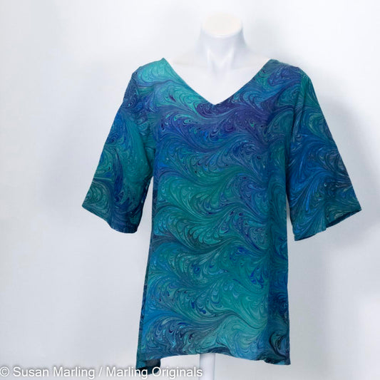 half length sleeve tunic with v neck in marbled pattern of blues and greens