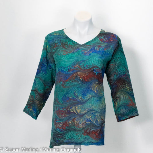 marbled silk tunic v neck with 3/4 sleeves.  Green with blue, red, yellow feathered pattern