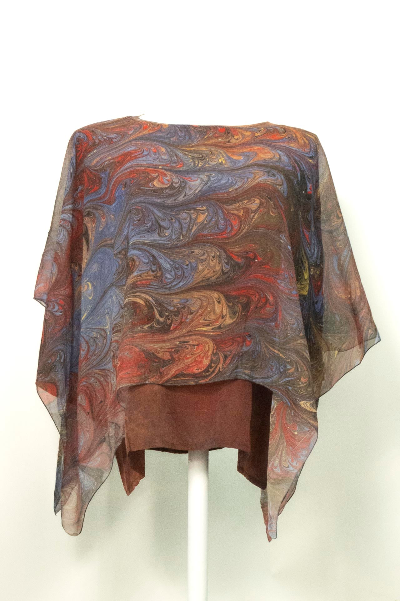 marbled sheer poncho in brown, gold, red and gray