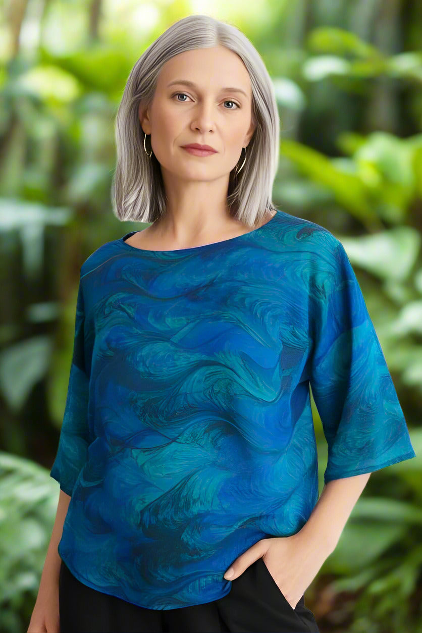 woman wearing an emeralds double marbled silk shirt round neck half sleeve