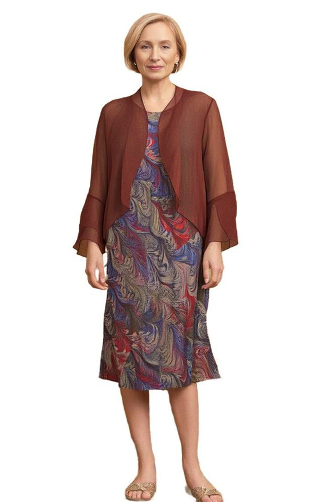 woman wearing marbled silk brown dress with sheer jacket