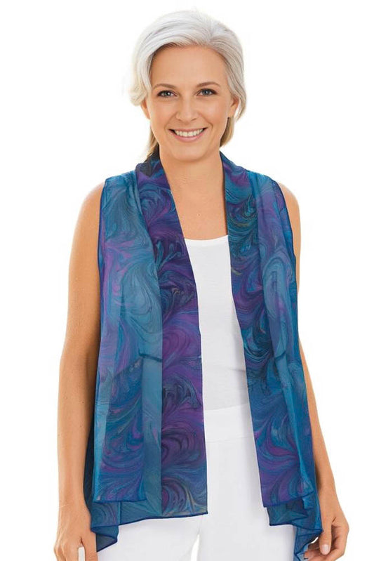 woman wearing a marbled silk chiffon vest in turquoise, pink & black