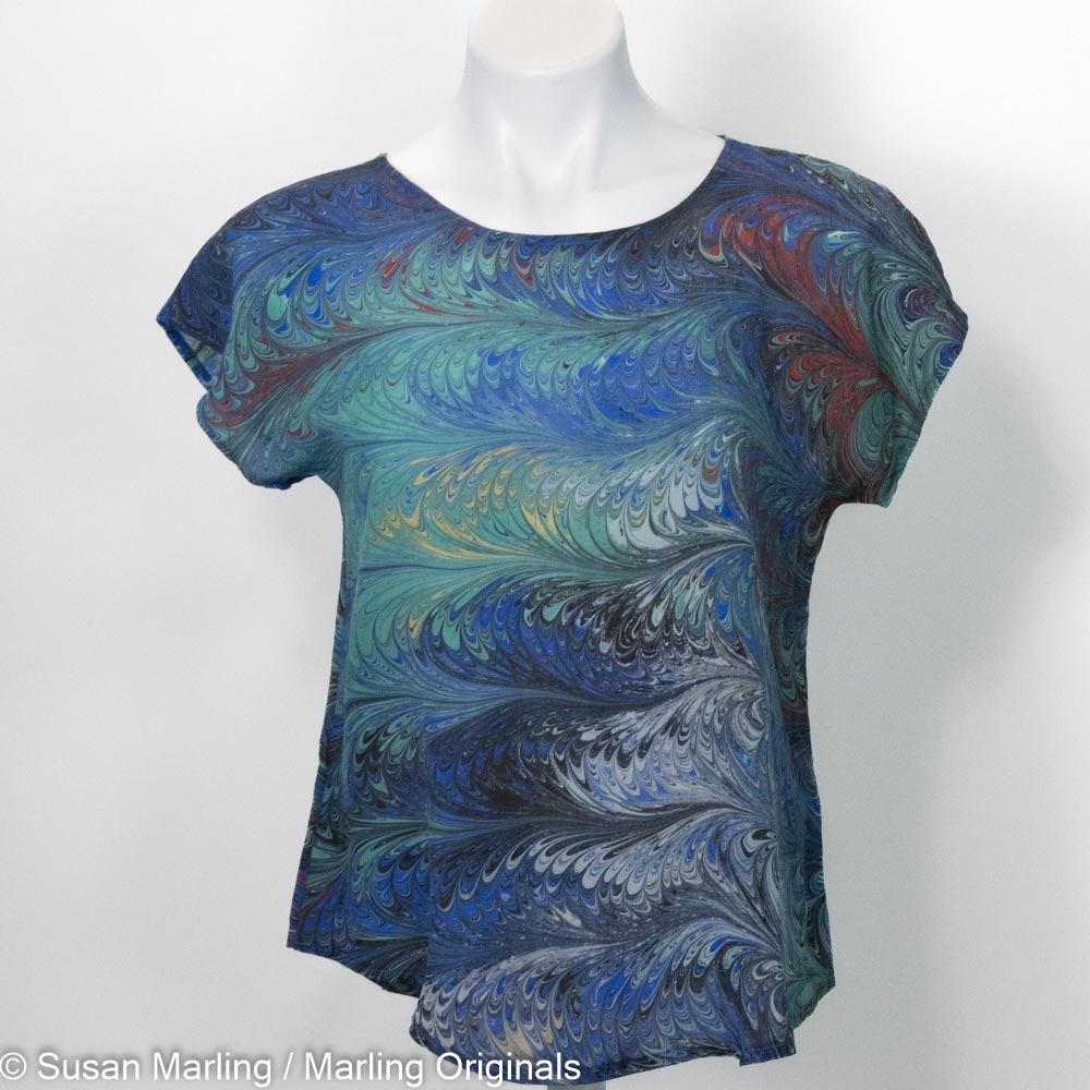 marbled silk top with short sleeves and round neck.  Blue, green, red, with yellow and white