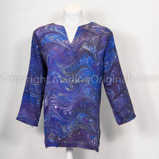 picture of hand marbled tunic in rich purple and blues.  V-notch neck with side slits, 3/4 sleeves