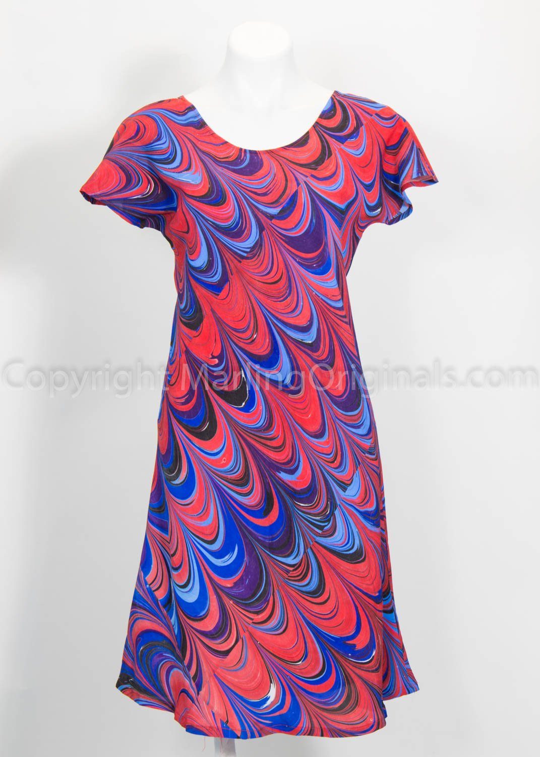 marbled dress in vibrant red, blues , black and purple cascade pattern