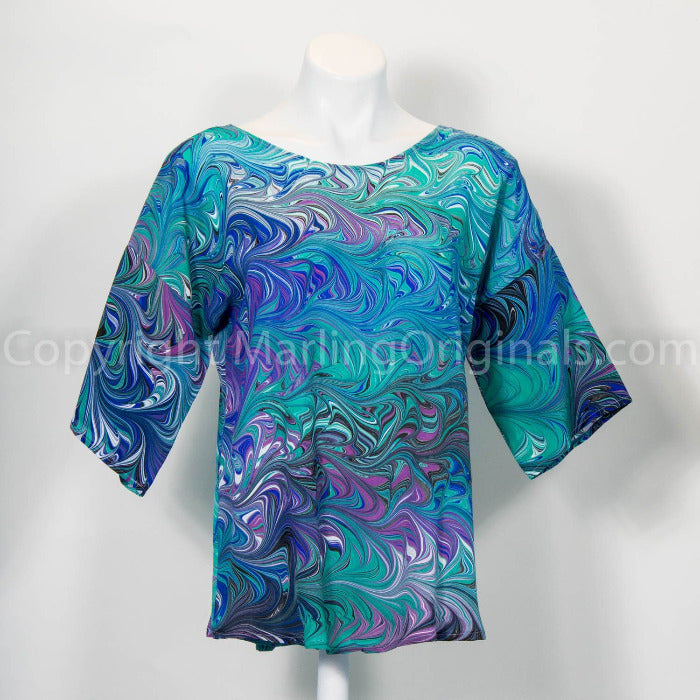 Hand marbled silk top in green, violet, blue, white.  Round neck, curved hemline, long sleeves.