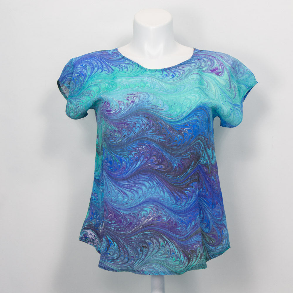 short sleeve summer top marbled in feathery pattern of blues and aquas.  Round neck