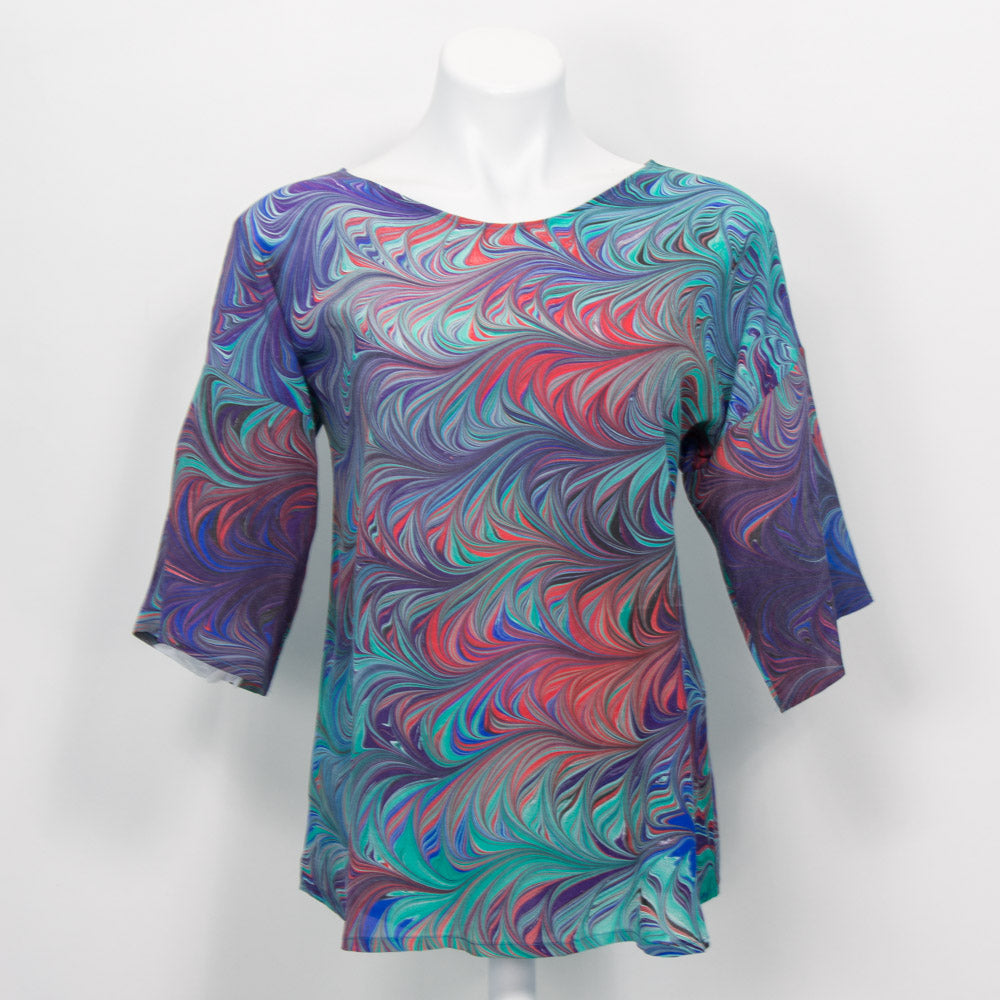 Half sleeve marbled summer top in blue, green, red and purple.  Round neck with curved hem.