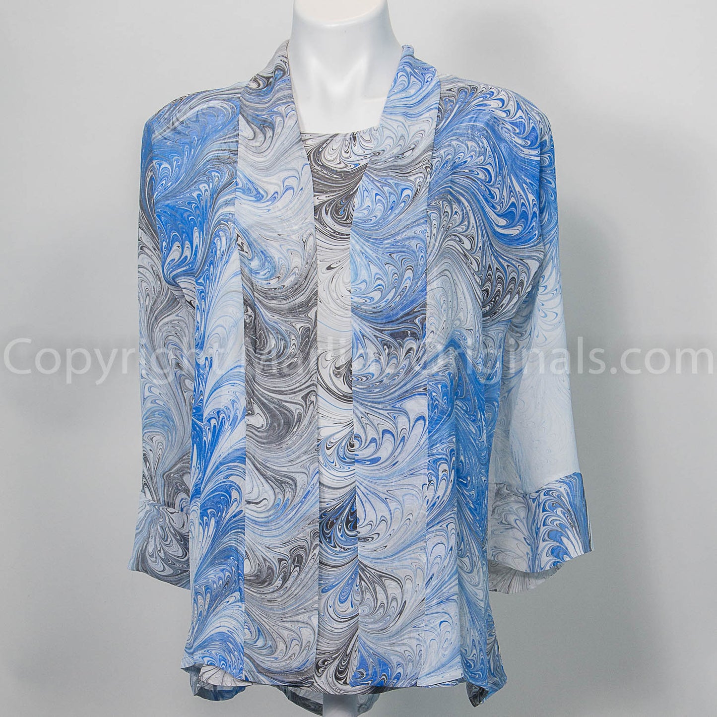 hand painted silk kimono style jacket shown with short sleeve silk top in blue, black and white