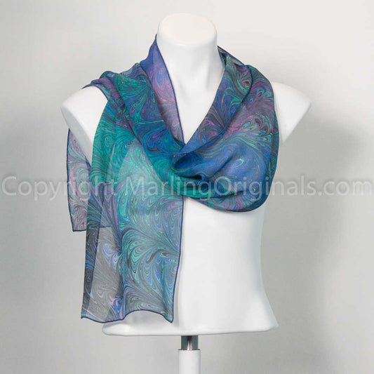 silk scarf with feathered marbling in jewel tones of blue, green and violet