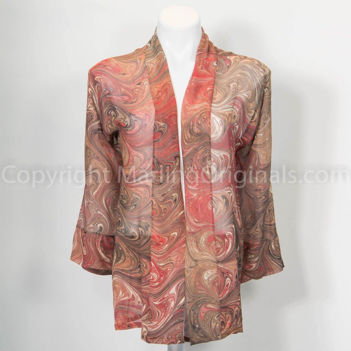 Sheer silk kimono marbled in coral and salmon tones.  Banded front, cuffed elbow-length sleeves.