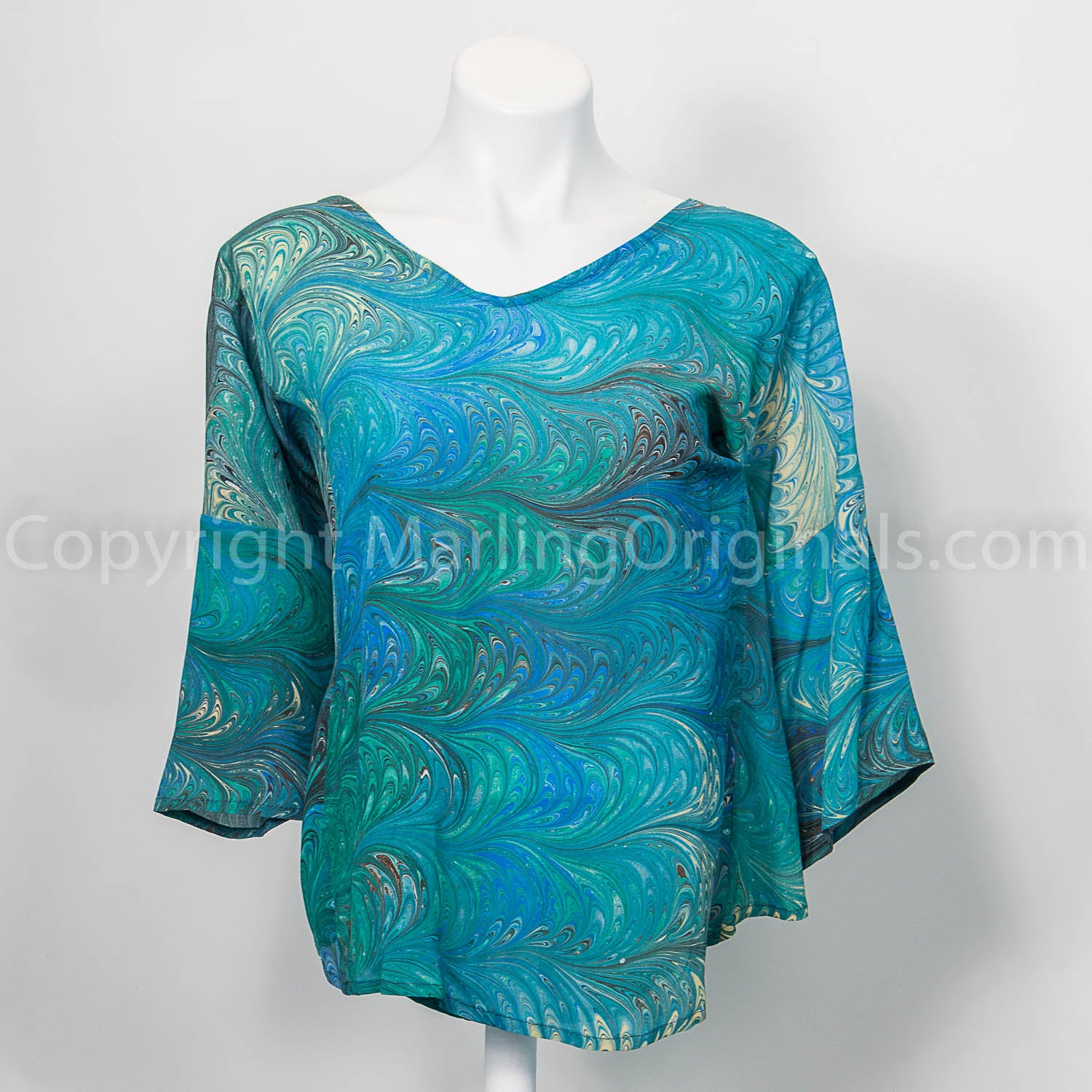 marbled silk top with v neck, faux princess seams and half sleeves.  Medium green with gray, ivory