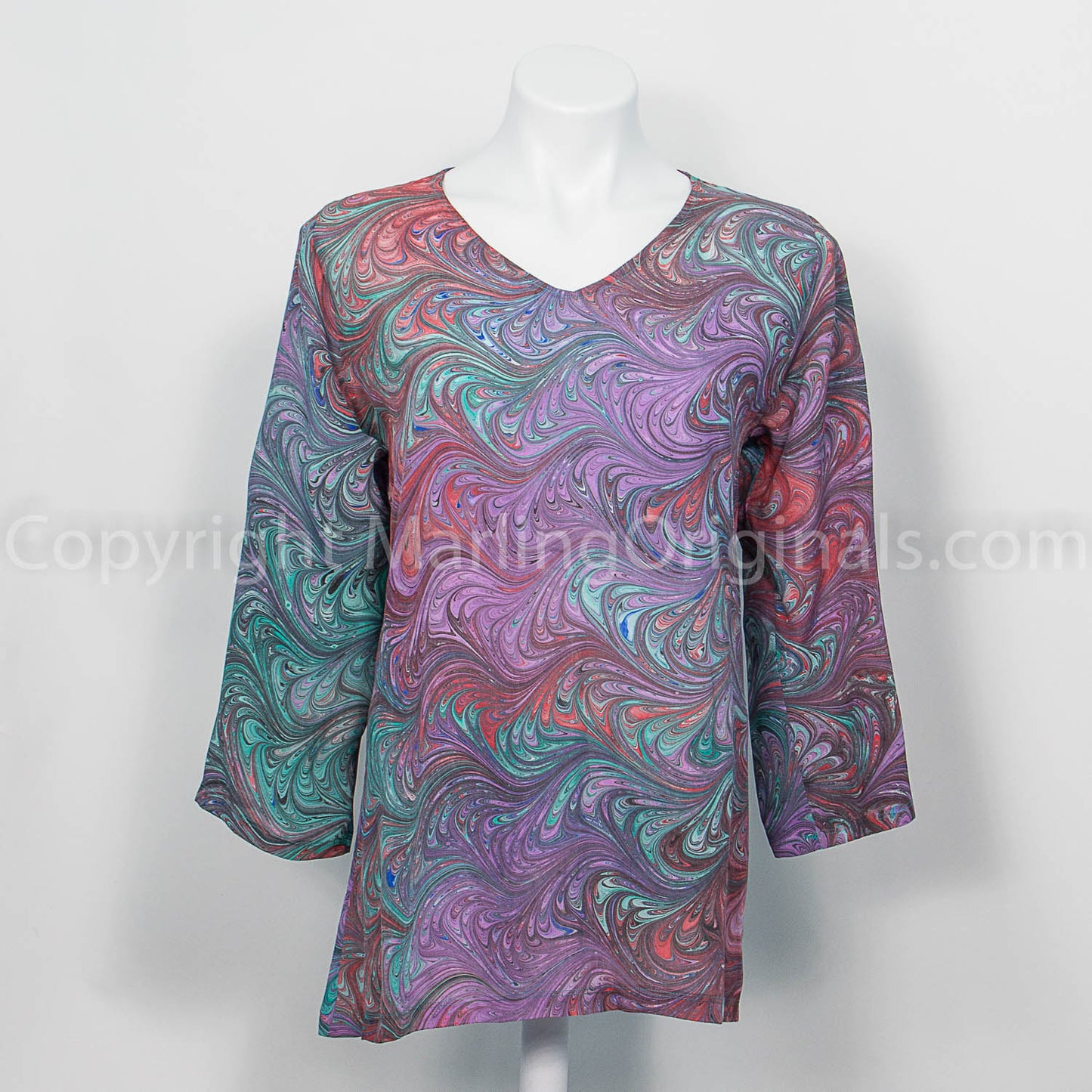hand marbled silk tunic with v neck and 3/4 sleeves.  Marbled in lavender, rose, red, green