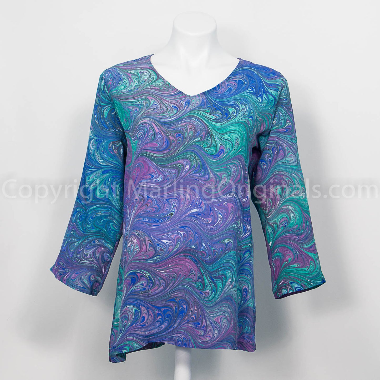 v neck silk tunic with 3/4 sleeves and marbled feather pattern in soft jewel tones
