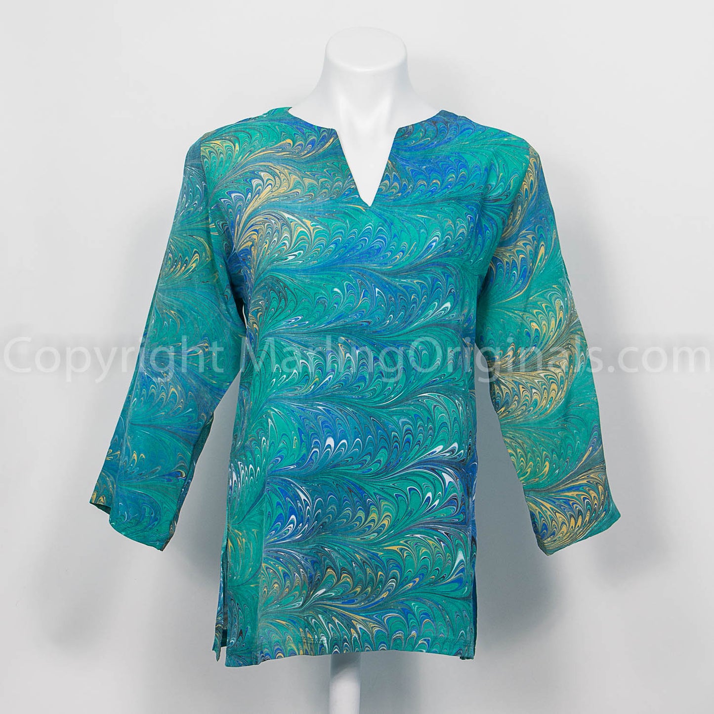 Silk tunic marbled in feathered pattern in greens, blues, yellow, white. 3/4 sleeve, notched neck.