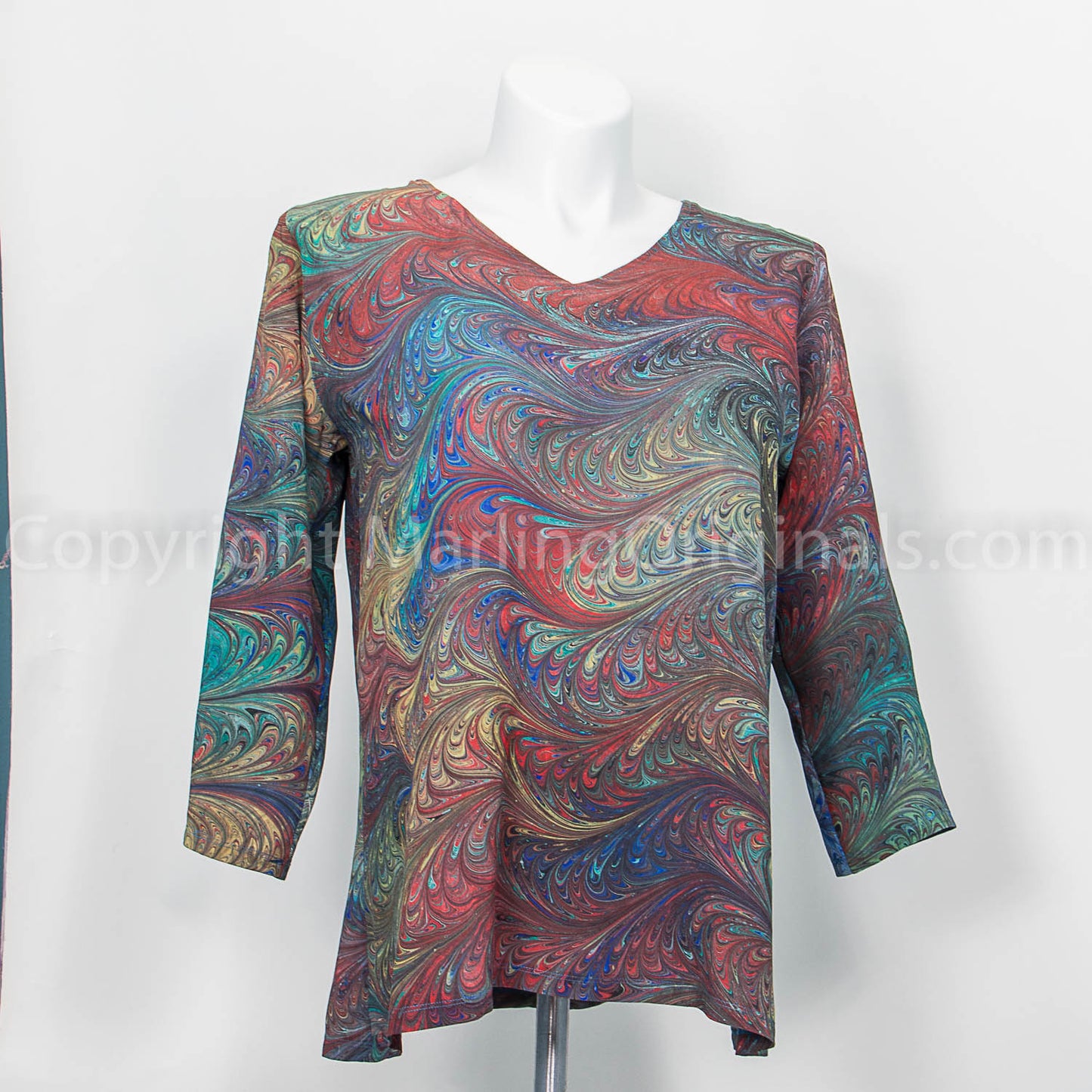 marbled silk v neck top in a feathered pattern with deep red and teal