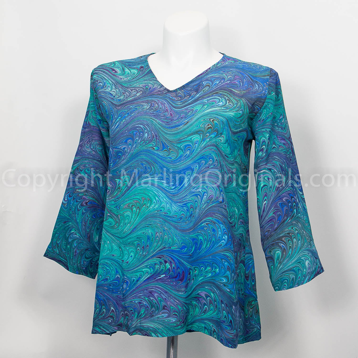 v neck silk tunic with 3/4 sleeves marbled in a feathery pattern in blue, green, purple