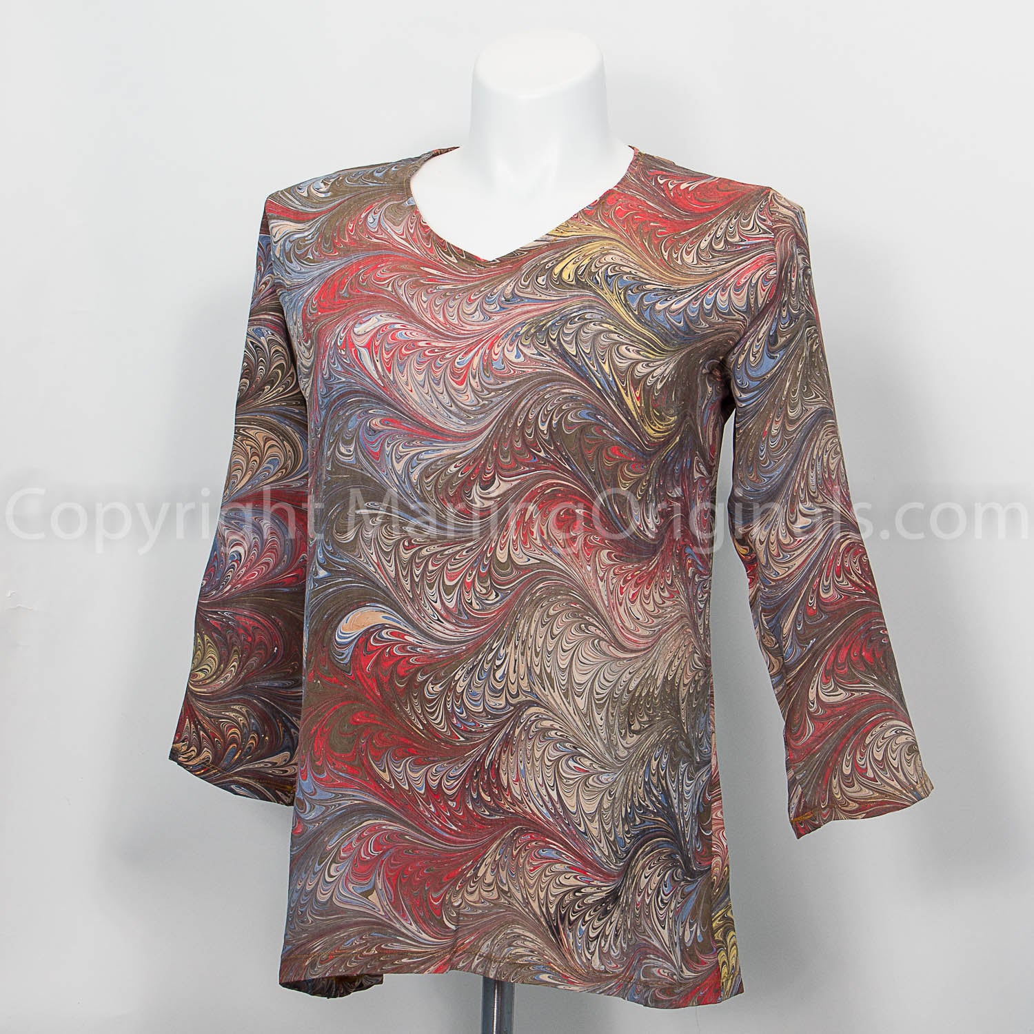 v neck tunic length top with 3/4 sleeves marbled in shades of brown with red