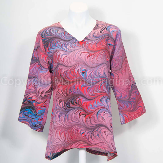 Marbled silk v-neck tunic length top.  Marbled in red, mauve, blues with v-neck, long sleeves