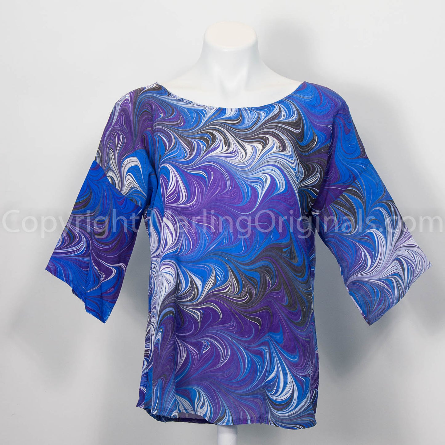 silk top marbled in rich blues and purple with white and black.  Dynamic twist pattern.