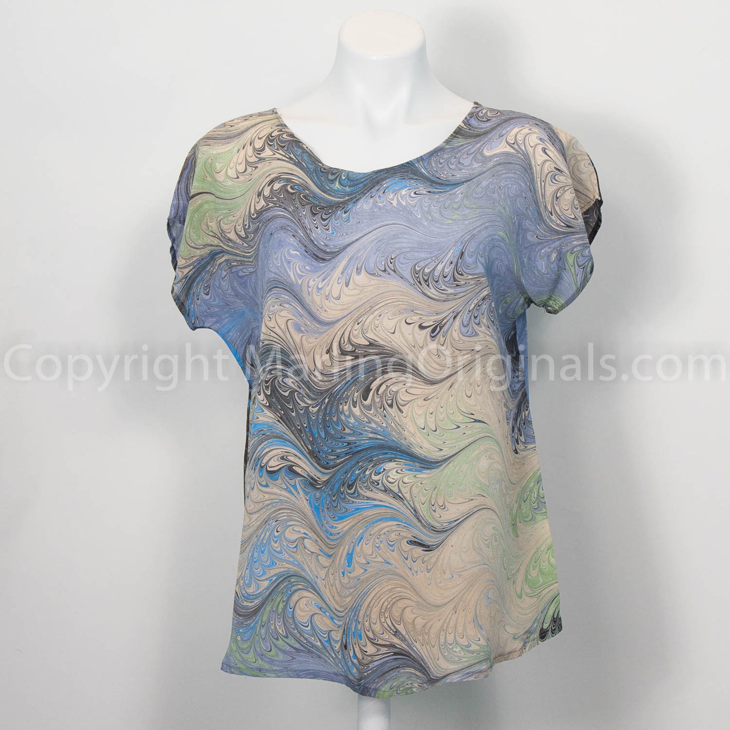 Silk top marbled in soft gray & sand with blue, black and celery accents.  Short sleeve, round neck