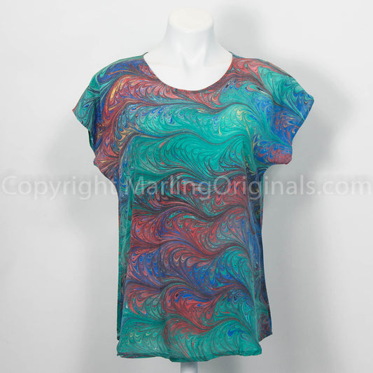 crepe silk top marbled in green with red, blue and black.  Short sleeve, round neck, curved hem.