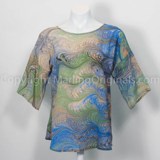 silk top with half sleeve and round neck. marbled print patern in blue, grey, peach, black, celery