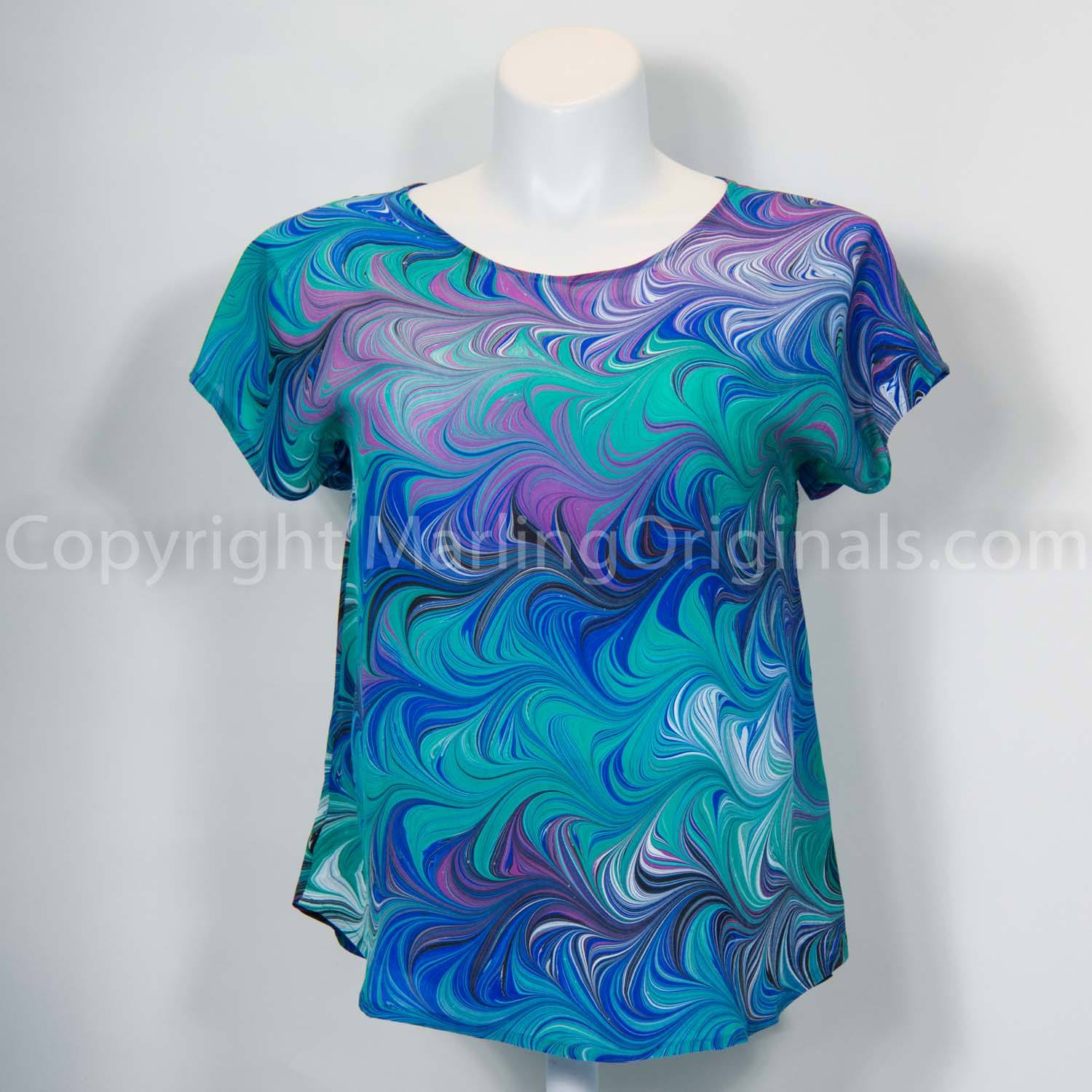 Hand marbled silk top in blue, green, violet and white.  Short sleeves, round neck, curved hem. 