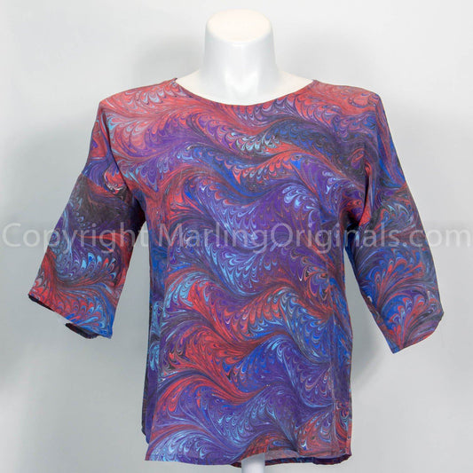 marbled silk top in purple, blue and red.  Longer sleeves, round neck, curved hemline