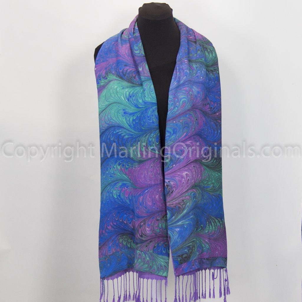 marbled silk coat scarf in rich blue, green, violet lined with violet acrylic fabric.  Fringed ends.