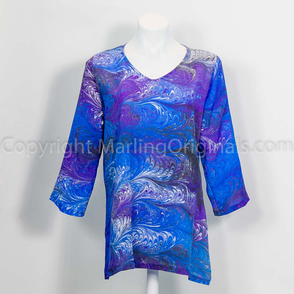 brilliant blue v neck tunic with 3/4 sleeves.  Marbled feather pattern.