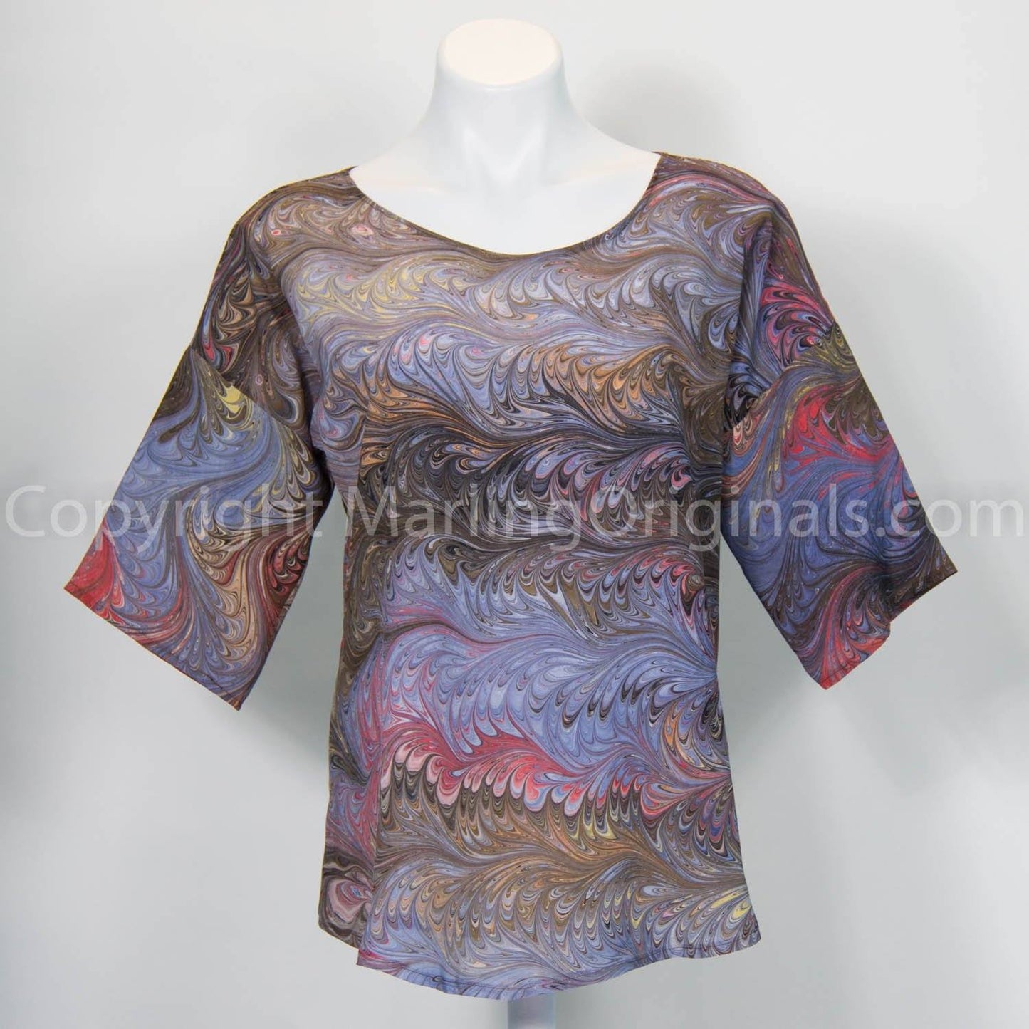 Marbled brown blouse has tones of grey, brown, red and black.  Half sleeve, round neck. 