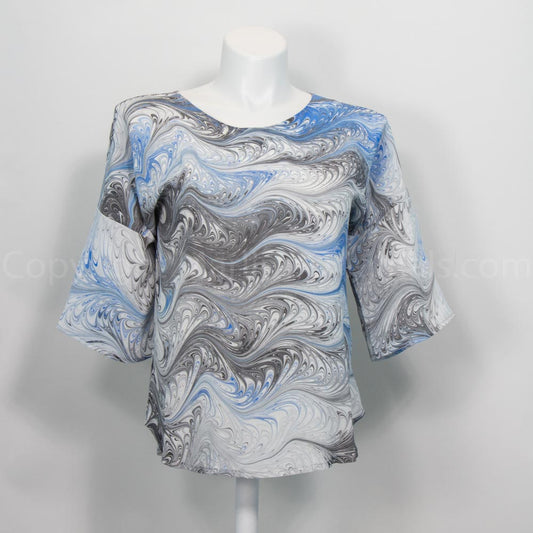 half sleeve spring top marbled in a feathered pattern of white, blue and black
