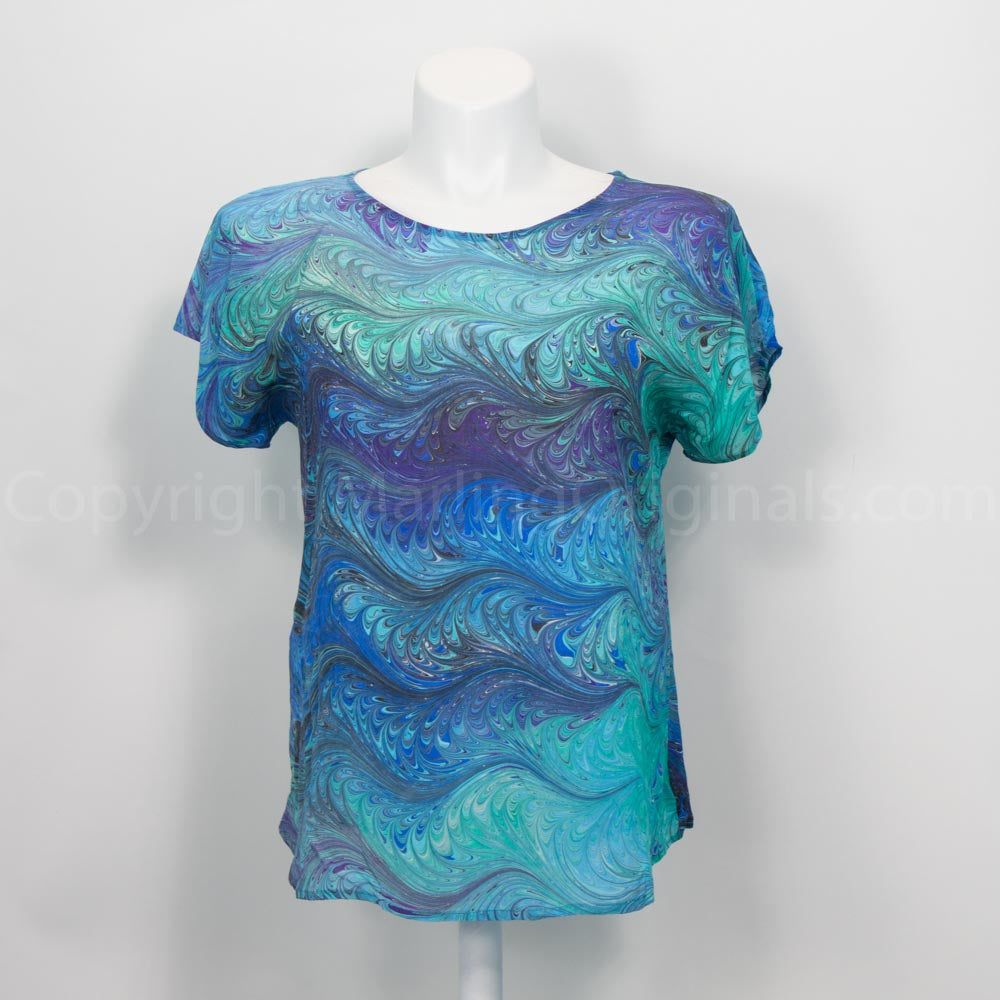 short sleeve silk top with feathered marbled pattern in blues and teals