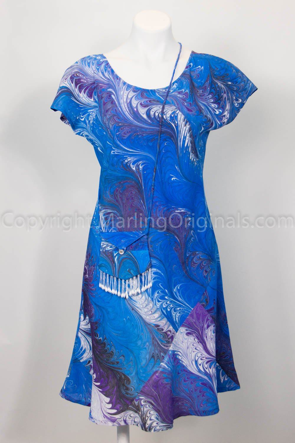 dress for smart casual in marbled blues and purples with bag