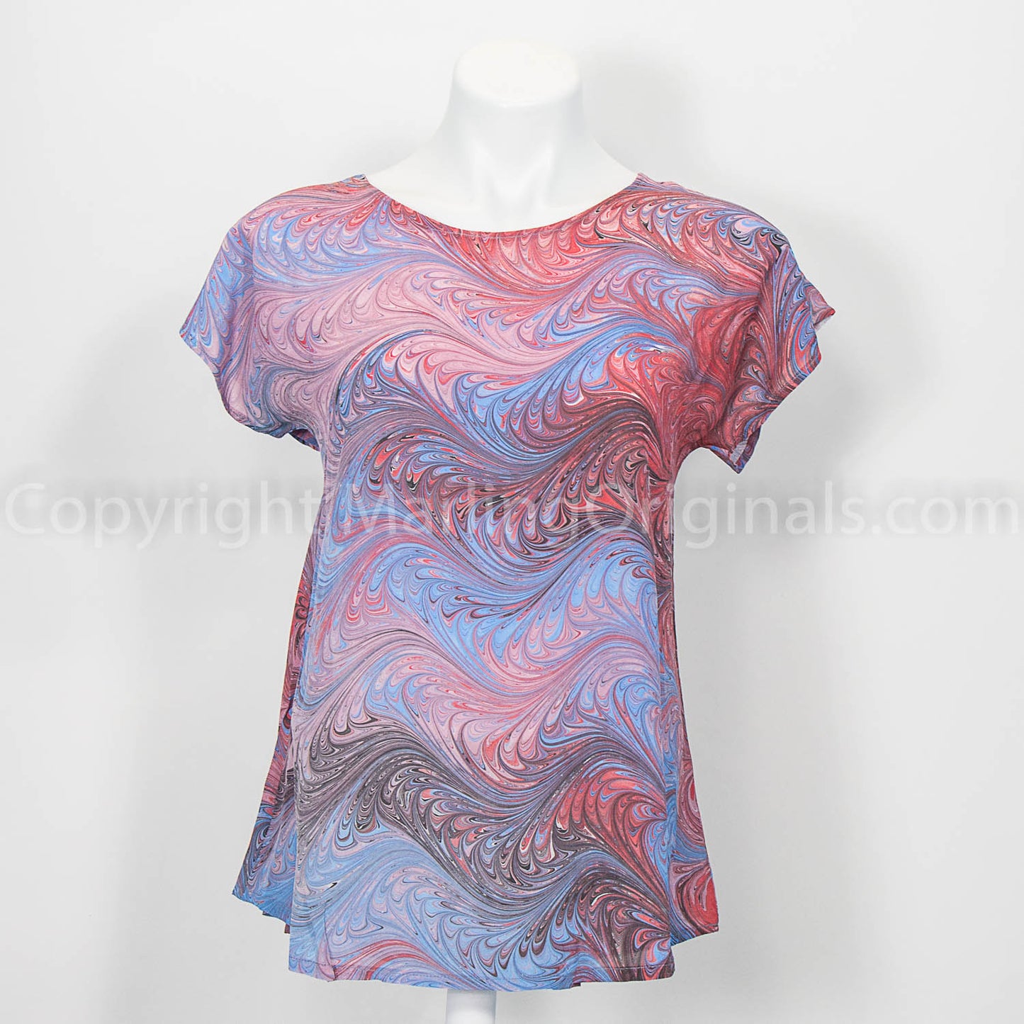 short sleeve silk top marbled with a feathered pattern in shades of mauve and sky blue