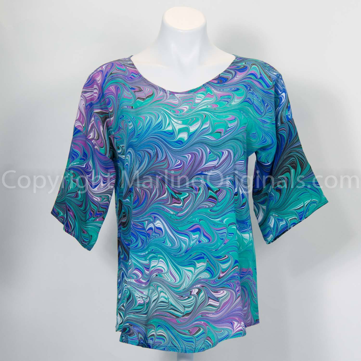 marbled blue silk top with round neck, half sleeve and curved hemline