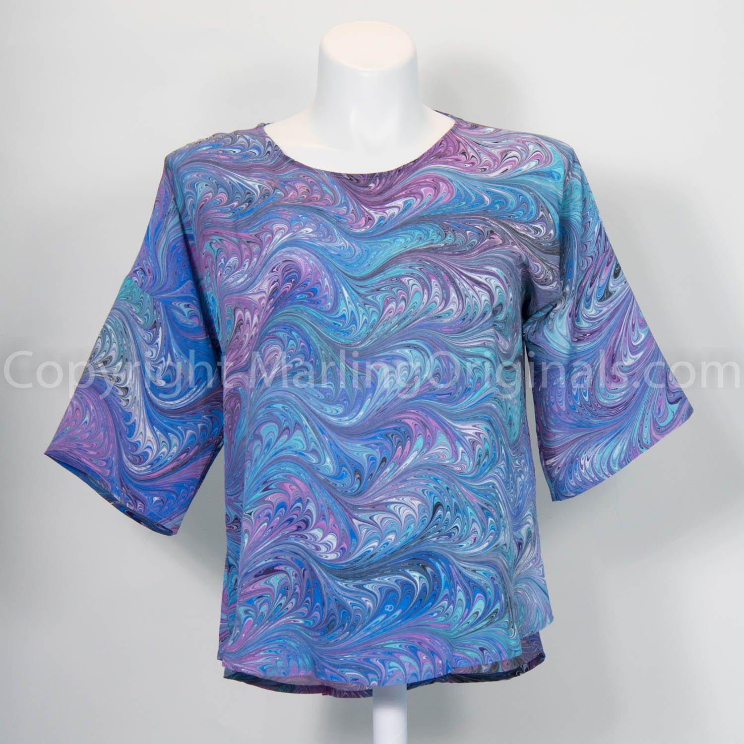 marbled blue silk top with artistic feathered patter in blues, violet, aqua.  Round neck and hemline