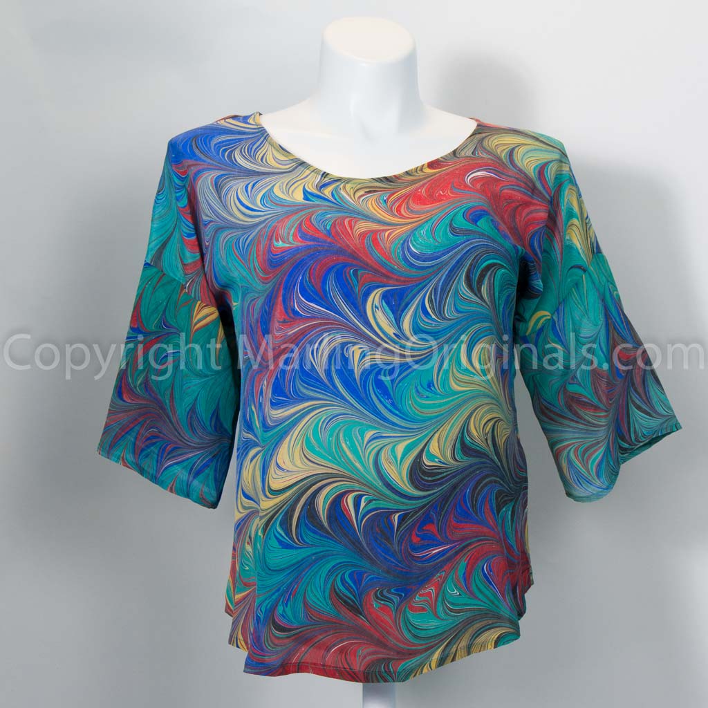 hand marbled silk top in blue, green, red, yellow.  Round neck, half sleeve, curved hem.