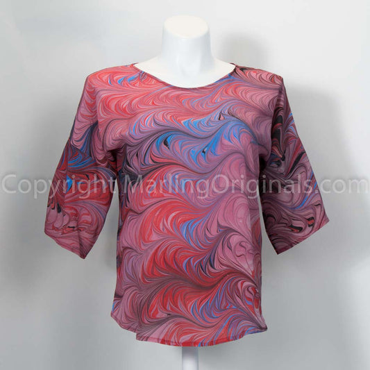 hand marbled silk top in red, mauve with blue and black. Round neck, half sleeve