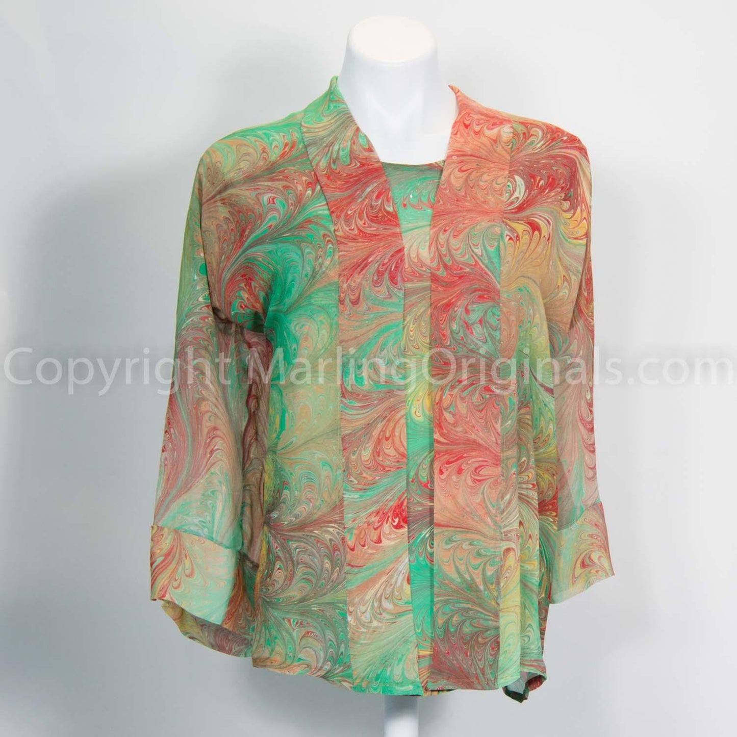 Hand marbled silk kimono shown with matching silk top.  Spring green with sienna, red, gold tones.