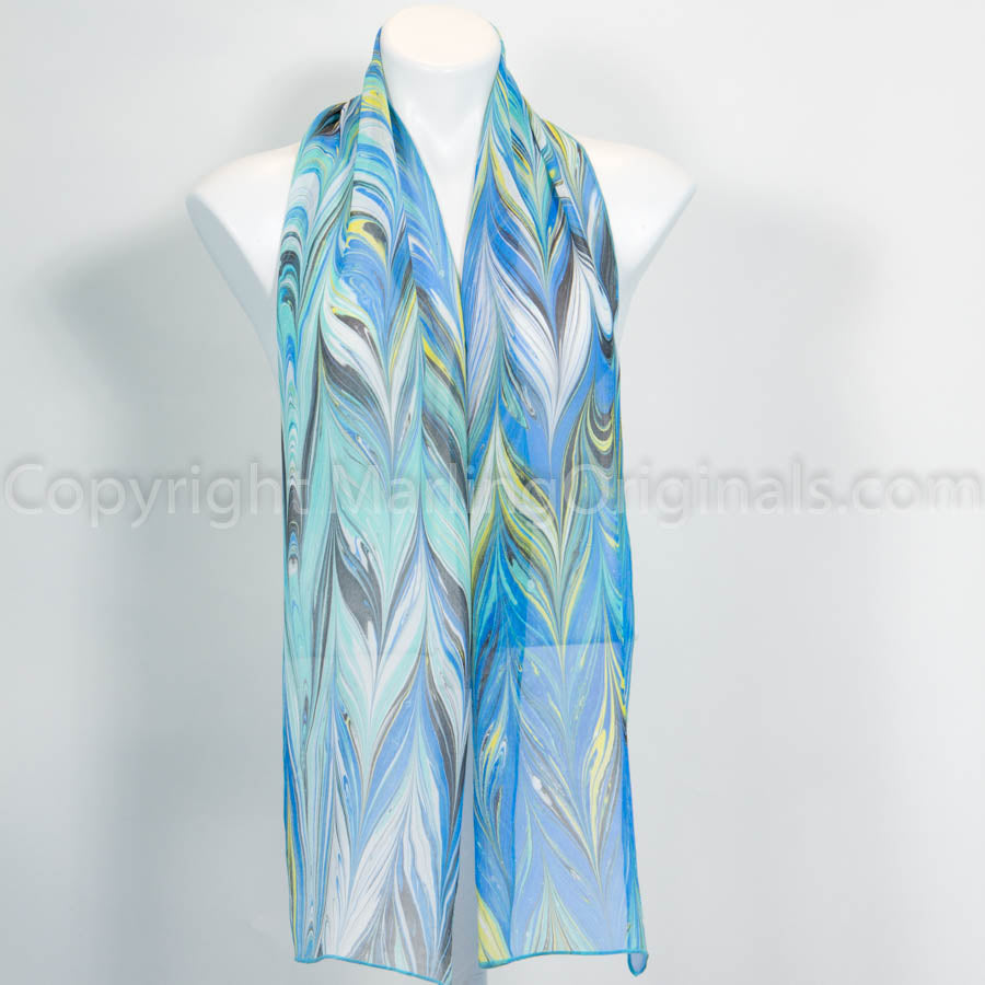 marbled silk blue scarf with white, aqua, yellow, black stripes.  10" x 67".